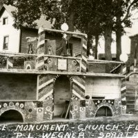 Postcard of the Wegner Grotto taken during the 1930s.  Shows the Peace Monument and Glass Church.  Note the Wegner's house in the background.